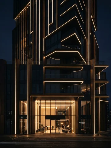 Sleek architectural LED lighting installation in a modern luxury building façade, dark moody evening atmosphere with precision warm gold light lines